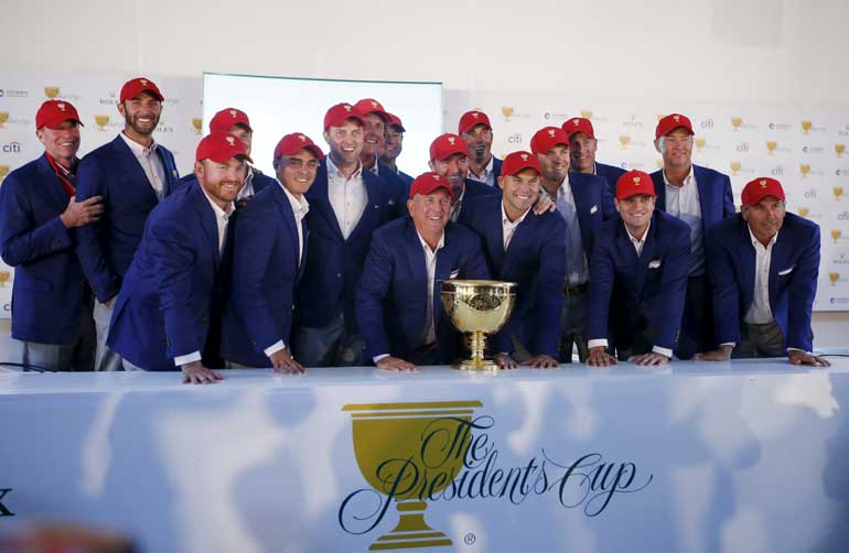 U.S. team members pose for group photo after a news conference of the 2015 Presidents Cup golf tournament in Incheon