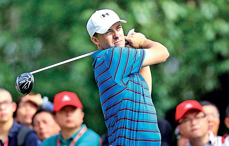 Spieth of the U.S. tees off on the 14th hole during the first round of the WGC-HSBC Champions golf tournament in Shanghai