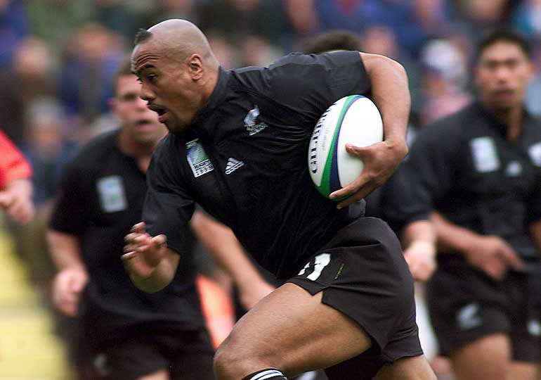 File picture of New Zealand's Jonah Lomu as he tucks the ball under his arm to run and score the All Black's first try against Tonga during their Rugby World Cup Group B match at Ashton Gate in Bristol, England