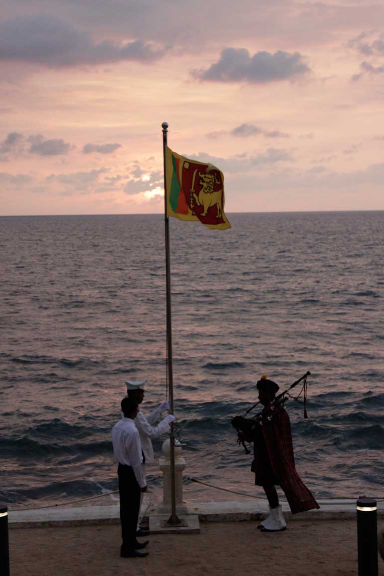 Lowering-of-the-flag-at-sunset