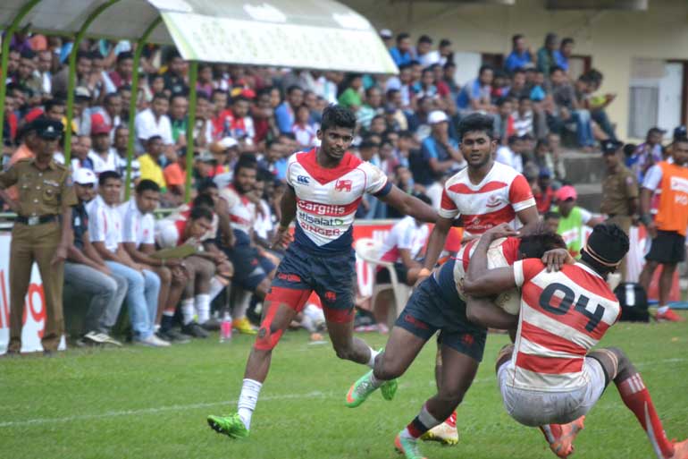 One-of-Kandy's-wingers-is-tackled-by-a-CH&FC-player