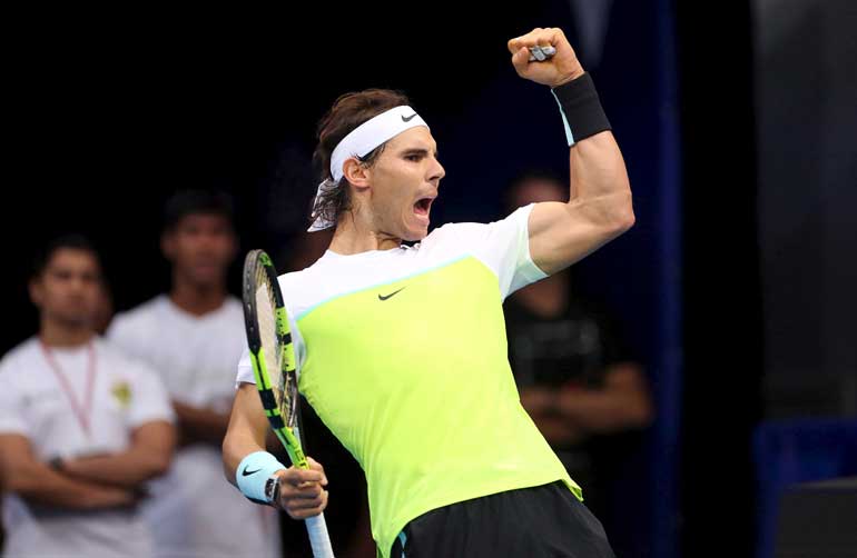 Micromax Indian Aces player Rafael Nadal of Spain reacts during a match against Manila Mavericks player Milos Raonic of Canada in their men's singles in Pasay