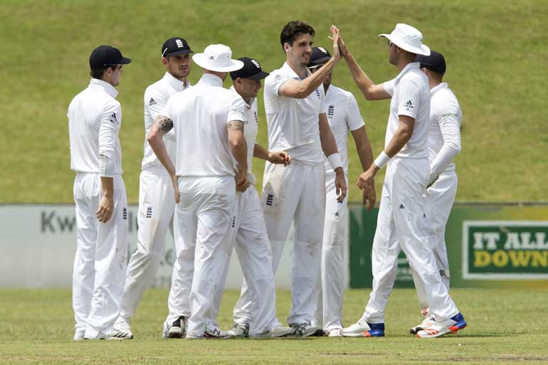 England's players celebrate a wicket during a tour match against the South Africa A in Pietermaritzburg