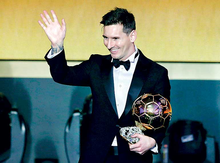 Messi of Argentina holds the World Player of the Year award during the FIFA Ballon d'Or 2015 ceremony in Zurich