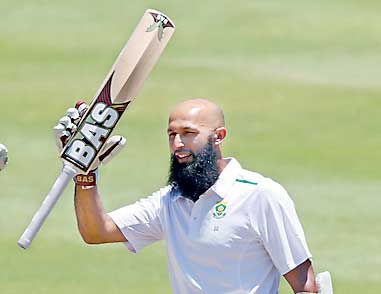 South Africa's Amla celebrates scoring a century during the second cricket test match against England in Cape Town