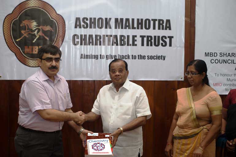 -COO-of-the-MBD-Group-Atul-Bahal,-hands-over-the-consignment-of-books-to-His-Worship-A.-J.-M.-Muzammil-the-Mayor-of-Colombo