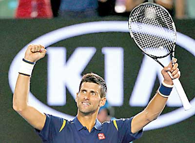 Serbia's Djokovic celebrates after winning his quarter-final match against Japan's Nishikori at the Australian Open tennis tournament at Melbourne Park