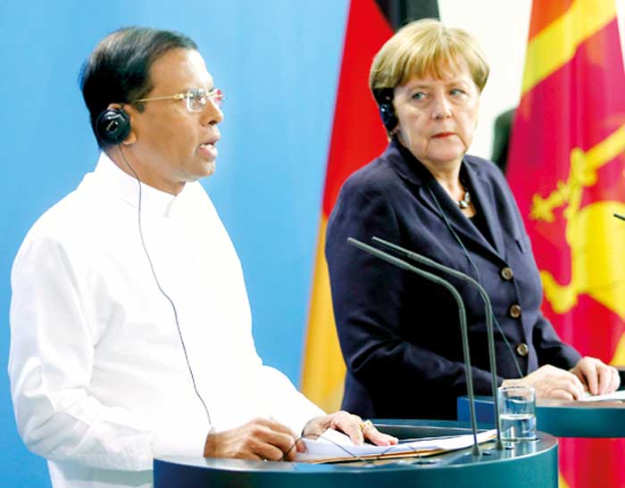 German Chancellor Merkel and Sri Lanka's President Sirisena address a news conference at the in Berlin