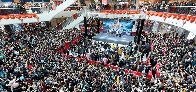 People attend a promotional event with Hong Kong star Stephen Chow for the film, The Mermaid, in Taiyuan