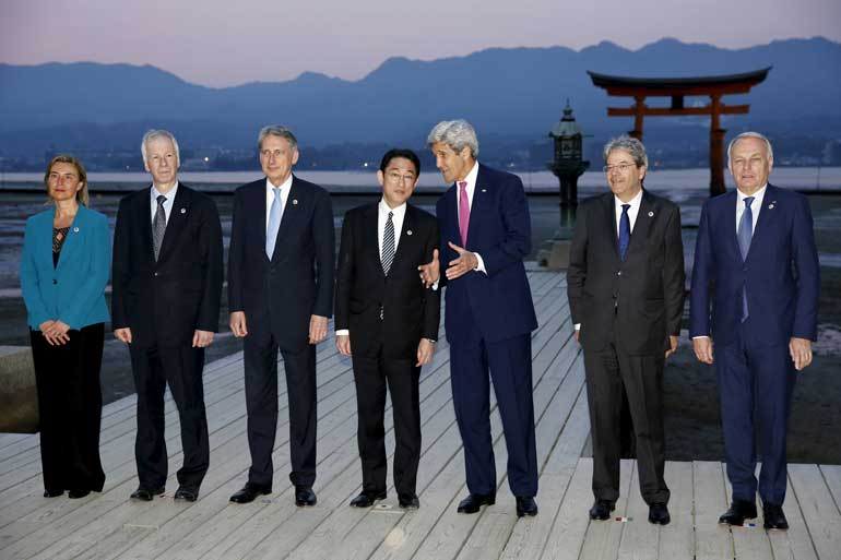 G7 foreign ministers take a family photo at the Itsukushima Shrine as they take a cultural break from their G7 Foreign Minister meetings in nearby Hiroshima to visit Miyajima Island