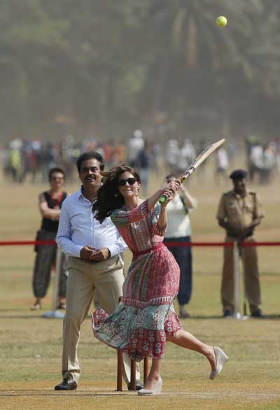 Britain's Catherine, Duchess of Cambridge, plays cricket with children at a ground in Mumbai, India