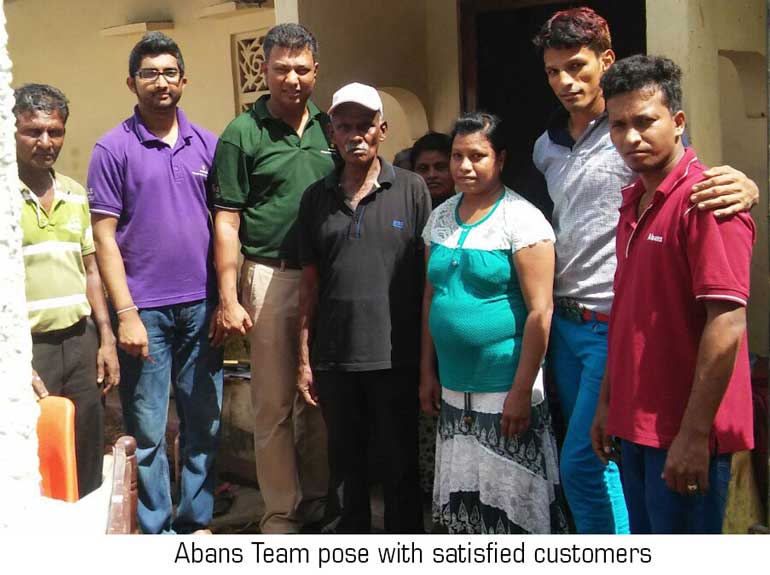 Abans-Team-pose-with-satisfied-customers