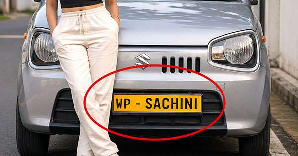 අයිතිකරුගේ නම ගහපු අංක තහඩුවක් ළඟදීම