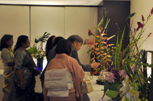 Visitors admire Ikebana and floral arrangements at the Festival of Flowers exhibition