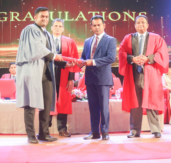 SLITHM graduate receiving a certificate during the 45th Graduation Ceremony at BMICH