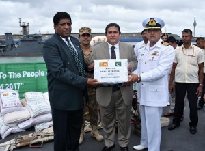 Acting High Commissioner Dr. Sarfraz Sipra handing over relief goods to Minister for Foreign Affairs Hon. Ravi Karunanayake